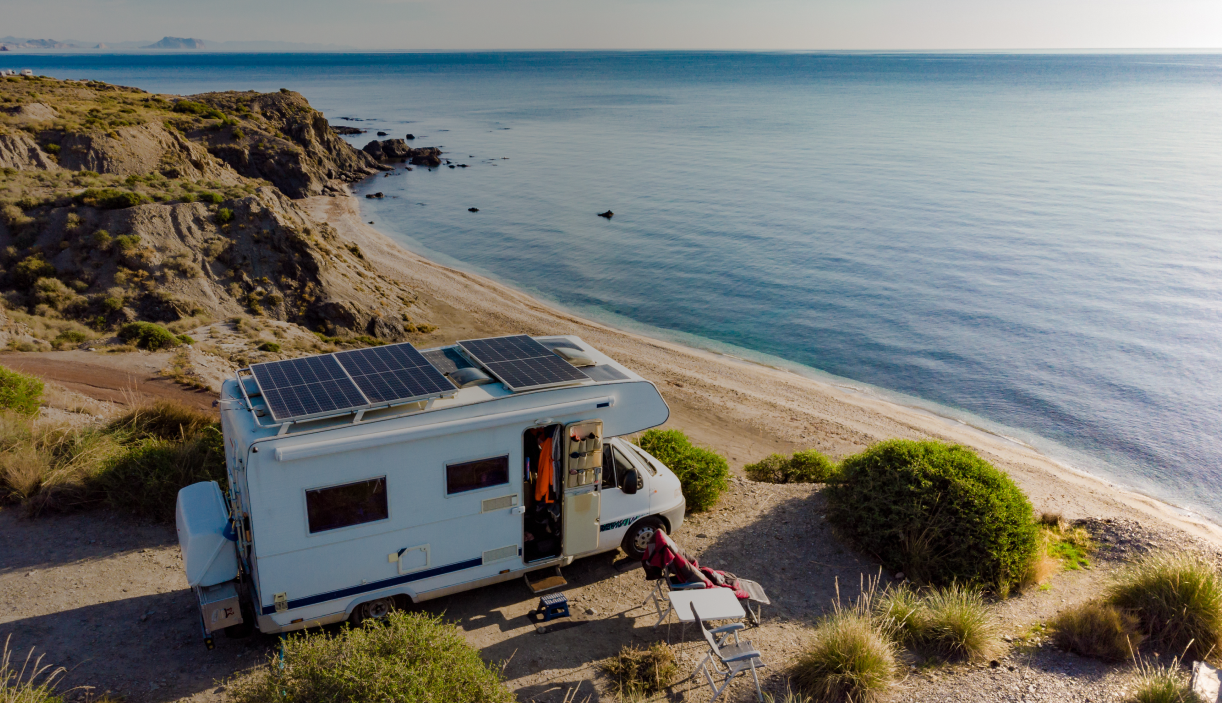 RV parked on a scenic beach